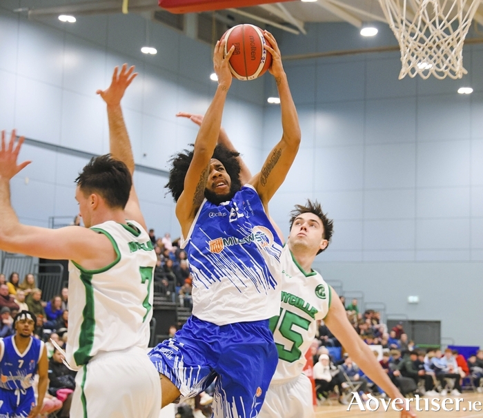 Maree Basketball Club’s Terence Lewis II splits Patrick Lyons and Kevin Nugent of Moycullen Basketball Club to find scoring position in action from the InsureMyVan.ie Super League game at the University of Galway Kingfisher Sports Arena on Saturday night. Photo: Mike Shaughnessy.