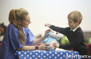 NUI Galway third year Medical student Sin&eacute;ad Burke with Cian (4) at NUI Galway&rsquo;s Teddy Bear Hospital today. Photograph by Aengus McMahon.