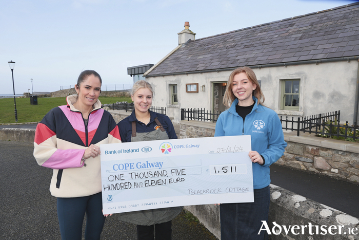 Pauline Hanley and Nicole O’Donnell of Blackrock Cottage in Salthill present Ciara McGrath of COPE Galway with a cheque for €1,511 which was raised by Blackrock Cottage at the annual Christmas Day Swim. Photo: Mike Shaughnessy 