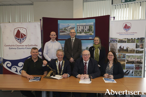 **No repro fee** Pictured at the construction contract signing for Caislean Raithan, Ardrahan, Back Row: Jason Lavelle (Executive Engineer, GCC), Michael Owens (Director of Services, GCC), Cuala McGann (OBFA Architects), Front Row: Donal McInerney (Jada Developments Ltd.), Cllr Liam Carroll (Cathaoirleach GCC), Liam Conneally (Chief Executive, GCC) and Eithne Murphy (Senior Executive Engineer, GCC). Photo Mike Shaughnessy.