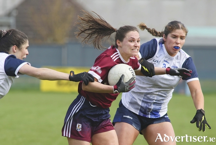 Galway’s Kate Geraghty is flanked by Waterford’s Hannah and Eve Power in action from the Lidl Ladies National Football League game at Duggan Park, Ballinasloe, on Sunday. (Photo: Mike Shaughnessy) 