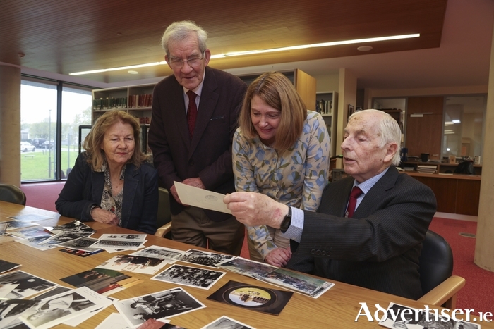  (Left to right) Retired Professor Jane Conroy with Professor Stephen G. Jennings, Dr Jackie Uí Chionna and Séamus Mac Mathúna, former Academic Secretary at the University, looking through donated photos from the Visual History of the University of Galway, Retired Staff Collection.