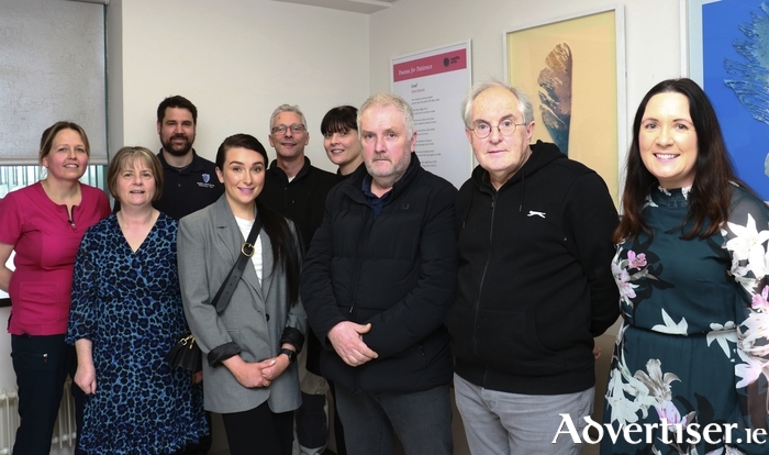 From left back row: Claire Lavelle, CNM3 Critical Care Unit; Joshua Walshe, Carpenter; Ray Madden, Painter; Gillian Shanahan; Organ Donation Nurse ManagerFrom left front row: Anne McKeown, End- of Life Coordinator; Isabelle Kenny, Donor Family; John Kenny, Donor Family; Mait Ó Brádaigh, Donor Family; and Margaret Flannery; Arts Director, Saolta University Health Care Group.