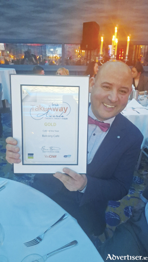 The Balcony Cafe proprietor Badia Zaidi is pictured with his Irish Takeaway Awards accolade