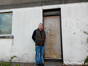 John McDonagh pictured at a vacant house at Munster Avenue.