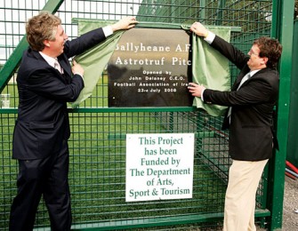 John Delaney, CEO Football Association of Ireland cuts the tape at the official opening of the Ballyheane AFC astroturf pitch assisted by Ballyheane's Walter Tuffy. Photo: Michael Donnelly