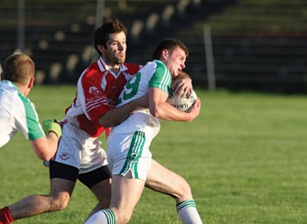 Welcome home: Ballaghaderreen’s Pearce Hanley gets a welcoming challenge in last weekend’s Mayo Senior Football championship clash agaist Ballintubber. Photo: Michael Donnelly.