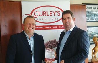 Joe Brady (Monster Organic Ball committee) pictured with John Curley (CEO, Curley’s Furniture).