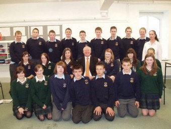 Deputy Michael Ring addressed the CSPE Junior Cert class at St Louis Community School, Kiltimagh last Friday. He is pictured with the students and their teacher Michelle Hession.