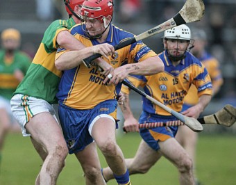 Portumna's Joe Canning is held by Gort's Brian Regan in action from the Safety Direct Senior Hurling Championship decider at Pearse Staium on Sunday. 	Photo:-Mike Shaughnessy