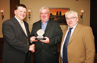 John O'Mahony presents an Outstanding Service award to Joe Regan at the Kilmovee Shamrocks Football Club annual dinner in the Abbeyfield Hotel,  Ballaghaderreen. Included in photo is John Caulfield, Kilmovee Shamrocks Club vice-chairman. Photo: Michael Donnelly.