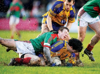 Getting to grips: Mayo’s Colm Boyle gets to grips with Roscommon’s Michael Duignan in last weekend’s FBD League clash. Mayo lost out by a point in a game that was played in horrendous conditions. Photo: Sportsfile. 