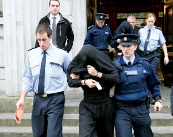 Thomas Freeman being brought from court by gardai including Garda  Alan Keane, who along with Garda Bernice Derrig were first on the scene during Sunday night’s incident. Photo: MIke Shaughnessy.