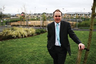 Get them when they’re young — Cllr Crowe renews his fractious relationship with trees at the Roscam playground.