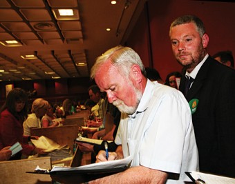Varying fortunes — Cllr Donal Lyons tots up the figures to his impressive total which in the background, Niall O Brolchain realises that for the second time in two years, he has been rejected by the electorate. Photo: Mike Shaughnessy