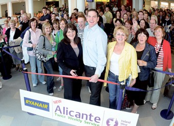 Cutting the ribbon at the launch of the new twice weekly scheduled service to Alicante International Airport from Ireland West Airport Knock with Ryanair are Lesley Kane (head of sales and marketing, Ryanair) and John McCarthy (operations and commercial manager, IWAK). 
