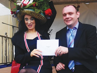 Pictured is Eithne Staunton receiving first prize in the Ireland West Airport Knock sponsored Mad Hatters competition at the Galway Races.

