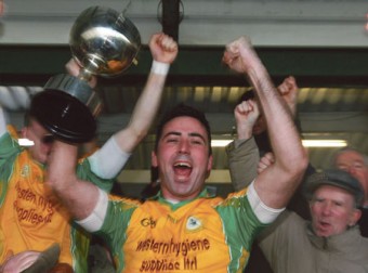 Corofin captain Kieran Comer celebrates after lifting the Shane McGettigan Cup. Photo:-Mike Shaughnessy