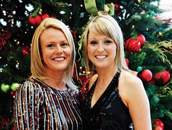Debbie Norman, manager, Born clothing from Kiltulla, Oranmore, enjoying the Christmas party at Born pictured with Tara Hanley from Moylough, who models a black halterneck Choifee sequinned dress from Vila (€69.95 at Born). 
Photo: Brian Harding