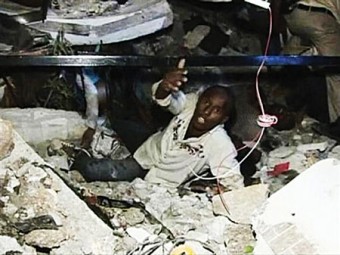 A man calls for help while being trapped at the Port-au-Prince University, after a major earthquake struck, in Port-au-Prince.