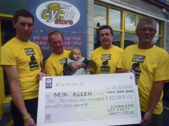 Mia’s hope: Nigel Ford, sponsor and team leader, Gerry Geoghegan holding baby Mia, John Broady, and organiser Johh Behan present a cheque to Mia Allen after completing a 200 mile cycling challenge. 