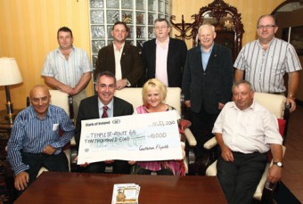 Pictured at presentation in the TF Royal Hotel and Theatre Castlebar, of Cheque for 10,000 Euros from Castlebar Route 66 Flyers to Angela McNulty, Temple Street Children's University Hospital,  front from left: Tommy Hurst, Donnacha Roche, Venue and Operations Manager TF Royal Theatre; Angela McNulty, Temple Street Hospital and Willie Scott; at back: Peter Gavin, Tom Tuffy, Pat Jennings, Michael MacHale and Paddy O'Donnell. Photo Michael Donnelly.