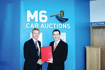 Caption: Pictured l to r Nigel Buttner, sales manager of Mapfre Asistencia, Ireland Assist, and Tom Lynskey of M6 car auctions.