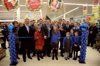 Two local Oranmore schoolchildren, Alison Blaney and Fiona Cannon, from Maree National School and Scoil Mhuire respectively, help Tesco Oranmore Store manager Martin Daly and Tesco Stores director Bernard Mahoney to cut the ribbon. 
