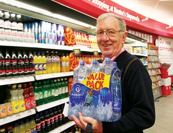 Stocking up &mdash; with water restrictions in place across the county, Benny Corcoran, Moneymore, Oranmore is pictured buying bottled water in Nestors Supervalu in Oranttown Centre last evening. Photo: Mike Shaughnessy