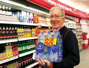 Stocking up — with water restrictions in place across the county, Benny Corcoran, Moneymore, Oranmore is pictured buying bottled water in Nestors Supervalu in Oranttown Centre last evening. Photo: Mike Shaughnessy