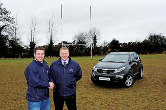 New Kia brand ambassador, Irish rugby player Sean O’Brien, takes delivery of his new Sportage at his home ground Tullow Rugby Club from Kia Motors Ireland managing director James Brooks.