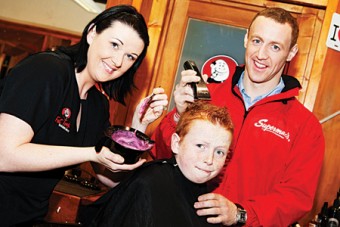 Carol Percy, Fat Tony’s, and Damien Joyce, captain Galway senior hurling team, help Liam Slevin get ready to 'Shave or Dye' for the event taking place in Supermac's, Eyre Square, this Saturday at 1pm.  Sports stars Damien Joyce, Joe Canning and John Muldoon will be shaving participants’ heads on the day in aid of the Irish Cancer Society.  Photo:  Martina Regan
