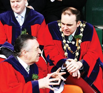 Mayor Michael Crowe and Cllr Padraig Conneely deep in discussion at the City St Patrick's Day Parade last week. Mayor Crowe chaired the mediation talks which resolved the standoff between Cllr Conneely and City Hall officials. Photo: Mike Shaughnessy