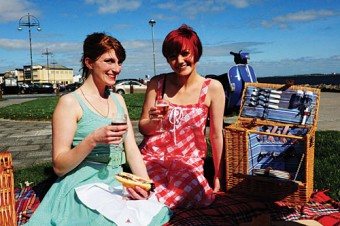 Sorcha Nic Aodha and Barbara Nic Dhonnacha prepare a perfect picnic in Salthill to get ready for Brewers on The Bay, Galway's Craft Beer Festival happening this weekend in The Oslo. Image: Boyd Challenger