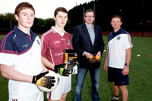 Paul Fleming of Atak Sports presents Galway u-21 player Conor Doherty, captain Colin Forde, and manager Alan Mulholland with gloves and Bodytech compression tops ahead of the All Ireland u-21 football final on Sunday. Photo: Reg Gordon