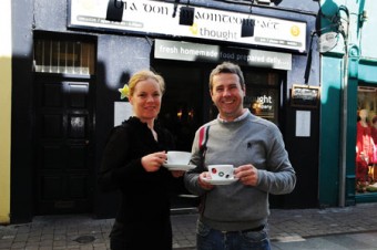 Gearóidín Ní Ghioballáin, Gaillimh le Gaeilge and Ken Walsh, Food 4 Thought enjoying a cup of tea outside the well known café on Lower Abbeygate Street. Bilingual signage is in use both inside and outside the café.