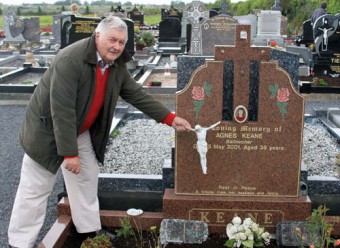 Cllr Jarlath McDonagh pictured at one of the damaged graves at Lackagh. Cllr Mc Donagh condemned the thuggery which saw graves and headstones damaged and desecrated.