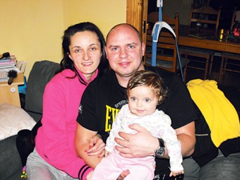 Andrew and Christina Zukaskaute pictured with Ieva, while below, Louise Blade shows her delight at the wellbeing of her daughter Audrey Cassidy’s god-daughter Ieva.