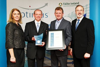 Fiona Monahan and Liam Campbell, Fáilte Ireland present, Tom O'Dwyer and John Ryan, The Ardilaun hotel with the Optimus Award for Service Excellence at a ceremony in Galway recently. Photo: Joe Travers