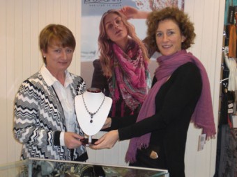 (Left) Mary Shaughnessy of Finishing Touches donating a necklace to Mary Finn of RehabCare for a raffle prize at the forthcoming Bag Fest in aid of RehabCare’s resource centre in Liosbaun. The event takes place on Sunday November 27 at the Meyrick Hotel from 12pm to 4pm.