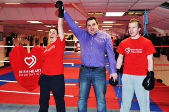 And the winner is...Ollie Turner, Galway Bay FM’s head of sport practising his refereeing skills at the announcement of the Irish Heart Foundation’s Big Heart Fight Night white collar boxing fundraiser with the Galway Advertiser's Donna Larkin, All-Ireland kickboxing champion, and Eric Daly, IKF European champion (Photo: Joe Travers)