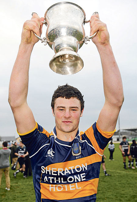 Robert Henshaw, Marist College, Athlone, lifts the cup after victory over Sligo Grammar School. 