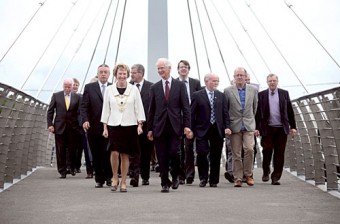No, they’re  not this year's entrants on The Apprentice — Galway City Mayor  Cllr Terry O’Flaherty and Keith Warnock, vice president for capital projects, NUI Galway walk over the newly launched O’Shaughnessy Bridge with members of NUI Galway and Galway City Council.