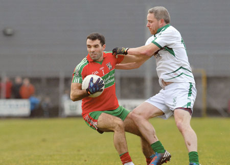 John Burke is tackled by Sean Daly during last Sunday’s Leinster club championship clash. Photo: johnobrienimages.com