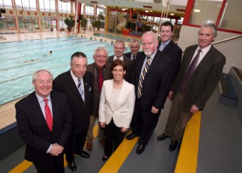 Relaxing poolside are Minister Ring and city councillors and officials.