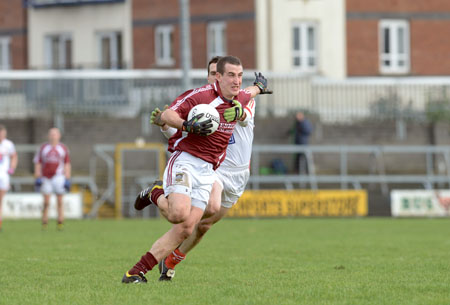 Michael Curley bursts past Conor Rafferty during last Sunday’s win over Louth. Photo: johnobrienimages.com
