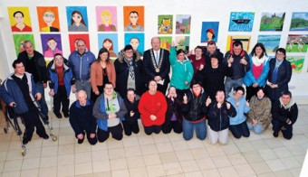 Pictured at an art exhibition held by Rehab Care in the Linenhall Arts Centre, which was opened by the Mayor of Castlebar, Councillor Brendan Heneghan is Cllr Heneghan with Emma Gallagher, external facilitator and the artists who exhibited their paintings. Photo: Ken Wright Photography 2013.