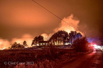 The night sky lit bright by the flames near Barna on Monday night. Photo: Clint Coen