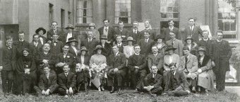 Front, sitting on ground from left to right: Jack Feeney, Leenane, Dick O’Toole, Tourmackeady, Dermot O’Hegarty ( Dáil Secretary), and Gearoid O’Suilleabhain TD (Carlow-Kilkenny).
Second row seated: Mrs Whelan, Clifden, Peter Joyce (Edgeworthstown), Thomas Francis Joyce, Griggins, Olive Joyce Rowlands, Rahoon, Eileen Acton Ó Máille ( bride), Pádraic Ó Máille (groom), Prof Tom Fahy, UCG, Arthur Griffith TD, Sarah Ó Máille Farrell (sister), Michael Collins TD ( Cork South),  and Mrs Liz O’Toole.
Row 3: Tommy O’Malley, Kilmilkin (cousin), Dr Michael Browne (later Bishop of Galway), Eamon Ó Máille ( brother), James Joyce, Hazelrock, Sinead Ó Máille (sister), PK Joyce, Clifden, Bridget Lowry Ó Máille, Thomas Ó Máille (brother), Eibhlin Scanlon Ó Máille (his wife), Petie Joe McDonnell ( Leenane), Irene Joyce, Jim Begley, Mary Joyce, Fr Dan Corcoran (later PP Clifden), and Fr Eamon O’Malley. 
Row 4: Nell Ó Máille, Dr Arthur Joyce, Annie Wallace, Renvyle, Mrs Una Joyce, Clifden, Paul Joyce, Griggins, Colm O Gaora, Carna, Tomas O’Toole, Peadar Ó Máille (brother), Peter Acton (brother of bride), and Con Collins TD (Kerry and Limerick West).
	(Thanks to Kathleen Villiers -Tuthill and Patrick McGinley for identifying everyone in the photograph). 
