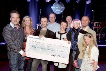 Stephen and Marie Therese Macken, organisers of the ‘Tiny Dancer’ fundraising single, present a cheque for €95,000 to Paul Hayes of the Sunni Mae Trust and Lily Mae Morrison with her parents Judith and Leighton and Lily Mae's cousin Bethany Casserley. Also in the photo is Stephen Smith of the Neuroblastoma Society which will share the proceeds, and Gary Monroe of Monroe's Live, who hosted the event. The Sunni Mae Trust was founded to support children with neuroblastoma, a rare form of cancer that affects 1 in 100,000 children in Ireland. 	Photo:- Mike Shaughnessy